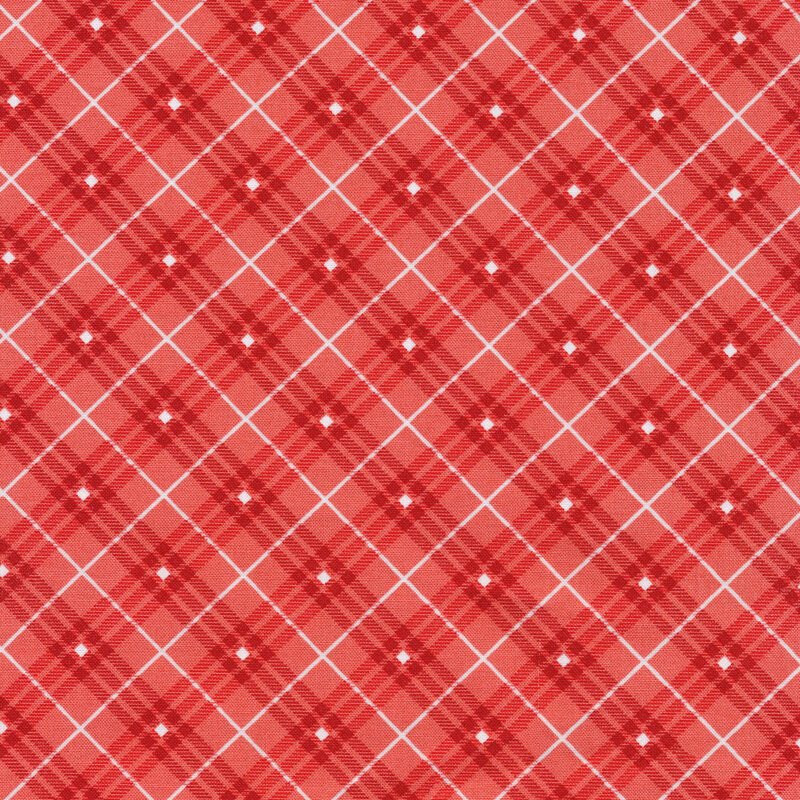 reddish pink plaid fabric with white stripes and diamonds