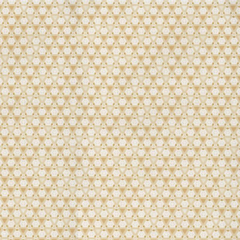 cream and tan geometric patterned fabric with gold accents