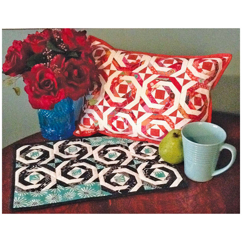 Pineapple Pillow or Placemat Pattern showing the finished placemat and pillow with a mug and a vase of roses.