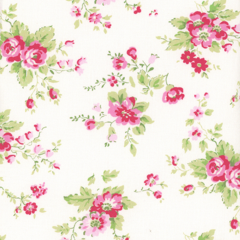 light cream fabric with tossed, contrasting pink roses and light green leaves on it