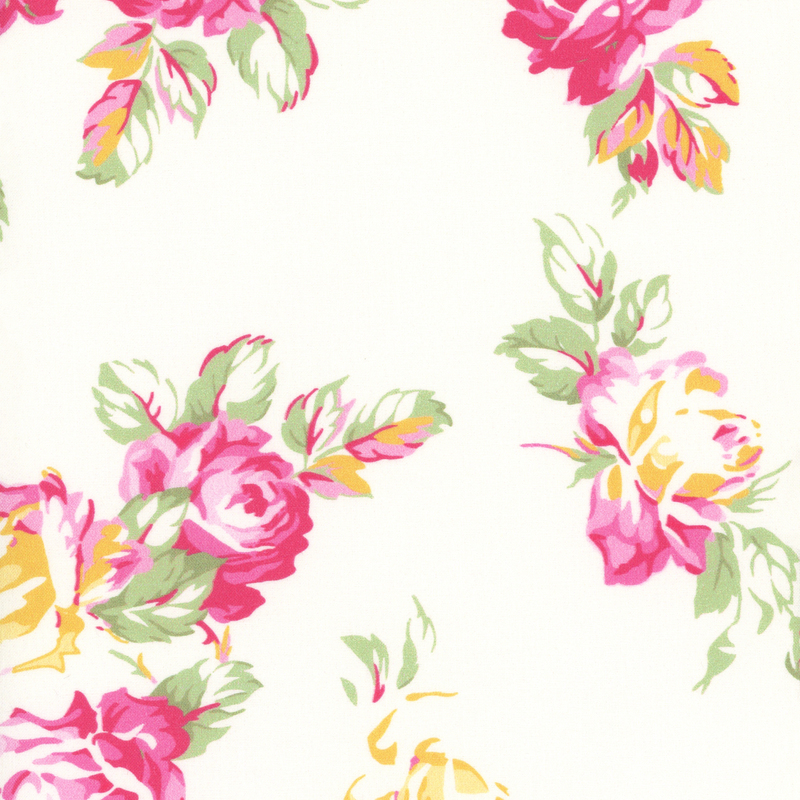 light cream fabric with contrasting painterly pink and yellow roses and dusty green leaves