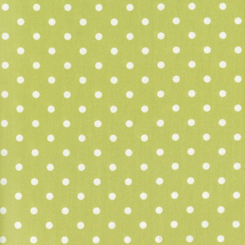 Bright green fabric with white polka dots across it