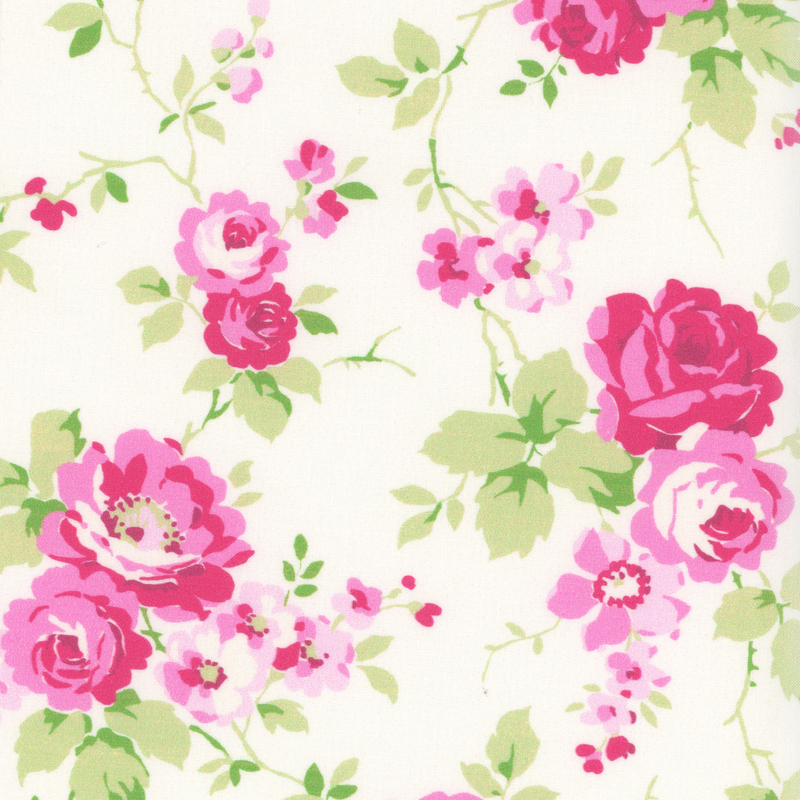Light cream fabric with bright pink roses and greens stems and leaves across it