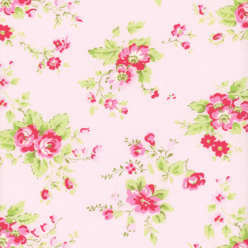 light pink fabric with contrasting pink roses and light green leaves on it