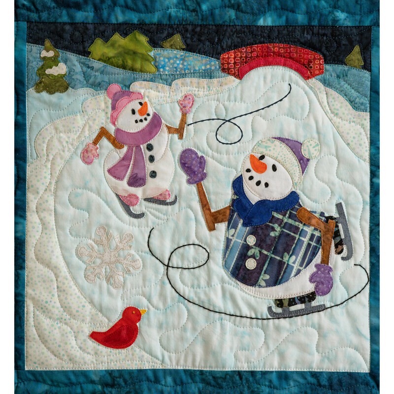Quilted block depicting two snowmen wearing hats and scarves ice skating on a frozen pond with a red bridge in the background and red bird in the foreground