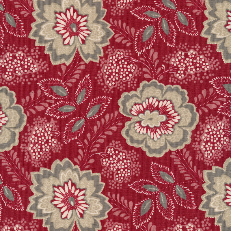 Floral fabric decorated with large gray flowers and bunches of small white flowers on a red background