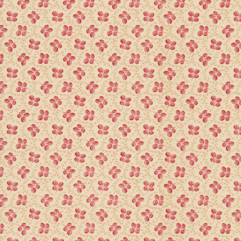 Fabric featuring sprigs of small red leaves, accented by tan vines on a cream background