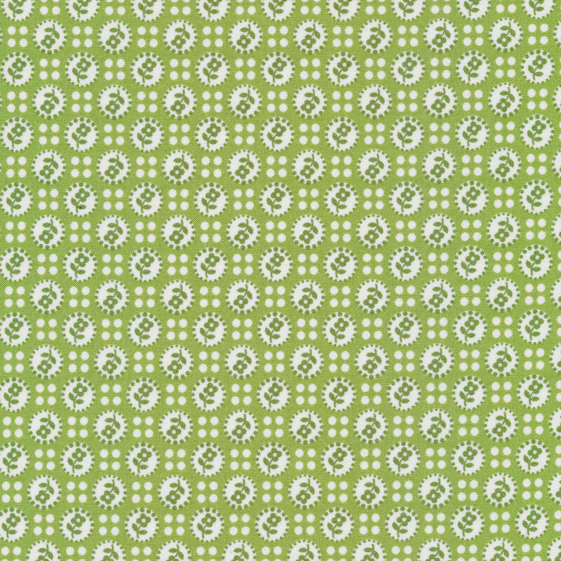 Sage Green fabric covered in white dots with flower silhouettes separated by four smaller white dots.