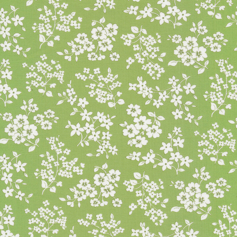 Light green fabric with tossed stemmed flower silhouettes with leaves in white