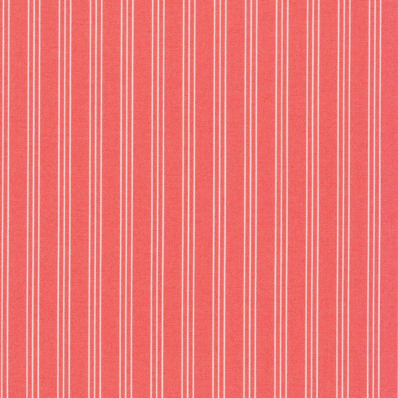 Pink fabric with groups of three white vertical pinstripes spaced evenly apart