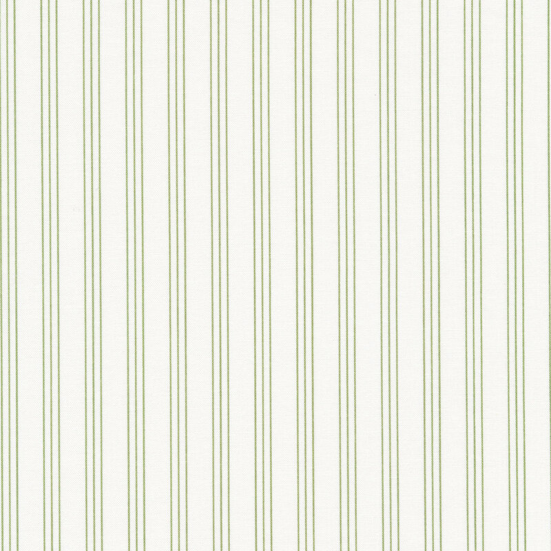White fabric with groups of three green vertical pinstripes spaced evenly apart