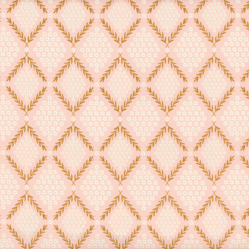 fabric with gold leafy vines bordering white flowers on a light pink background
