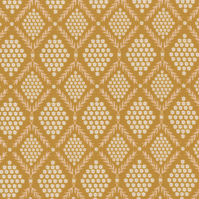 fabric with light pink leafy vines bordering white flowers on a golden yellow background