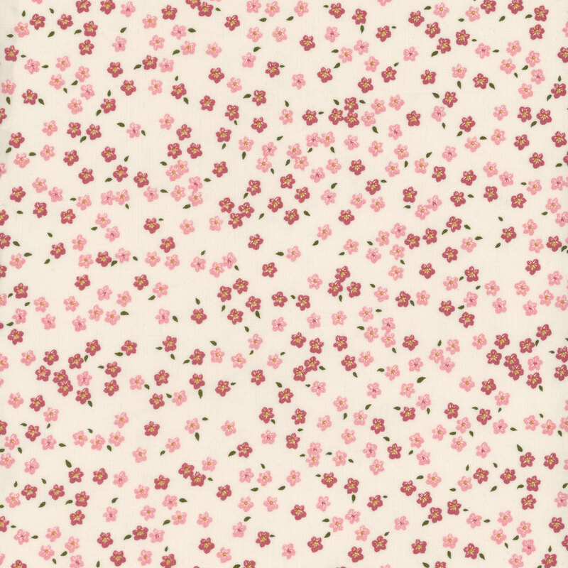 fabric with tonal pink ditsy flowers on a cream background