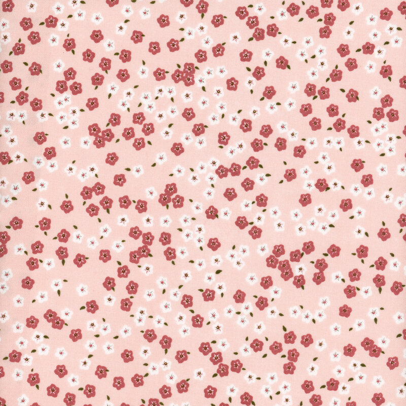 fabric with pink and white ditsy flowers on a delicate pink background