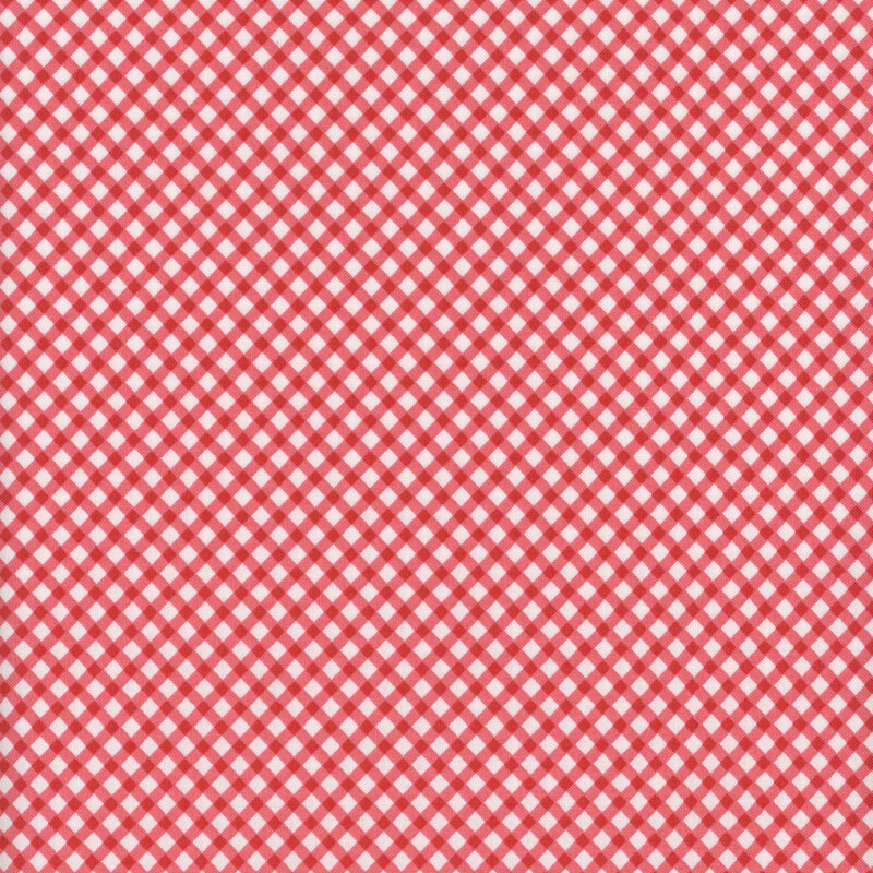Fabric featuring a red gingham pattern set against a light cream background