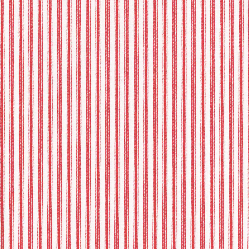 Fabric featuring red stripes set against a light cream background