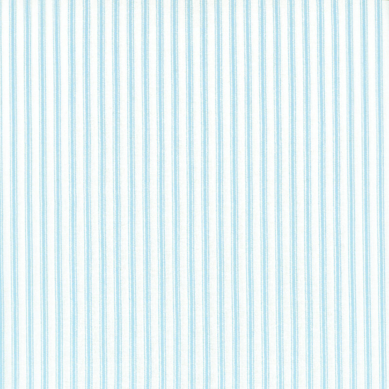 Fabric featuring blue stripes set against a light cream background