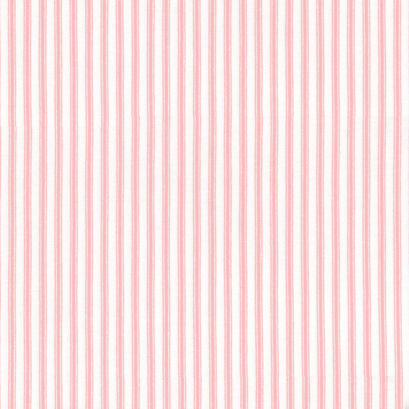 Fabric featuring pink stripes set against a light cream background
