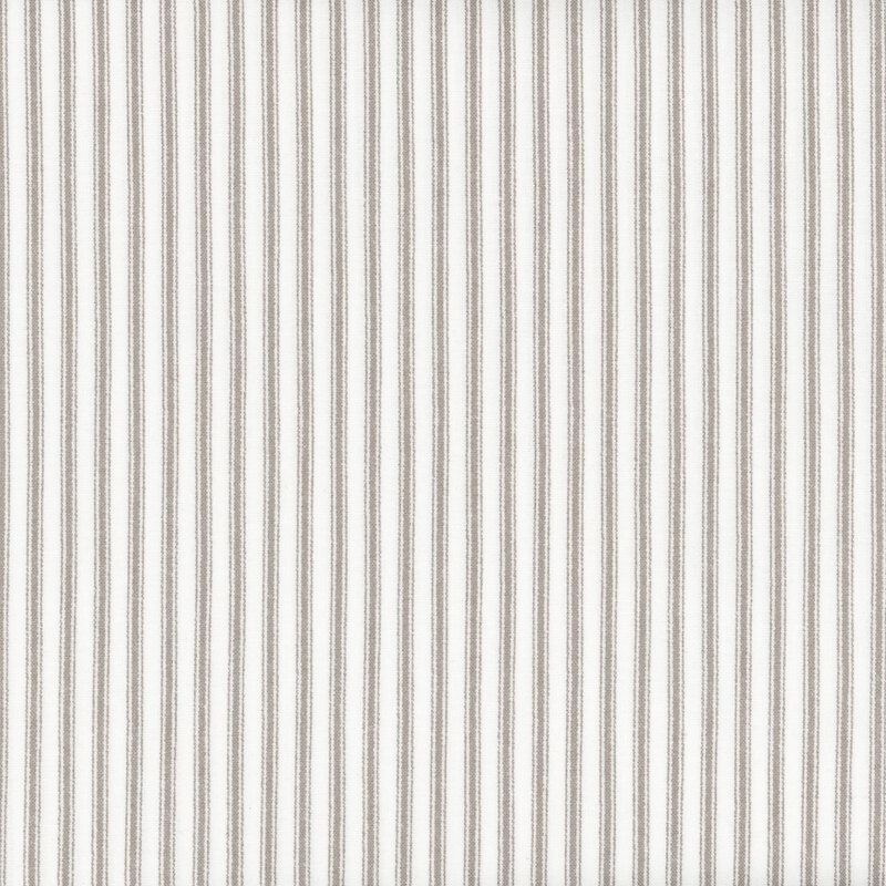 Fabric featuring gray stripes set against a light cream background