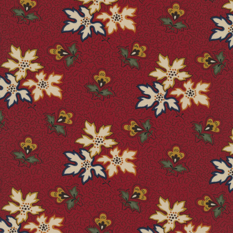 This fabric features clusters of multicolored leaves and flowers with squiggly abstract lines on a maroon red background.