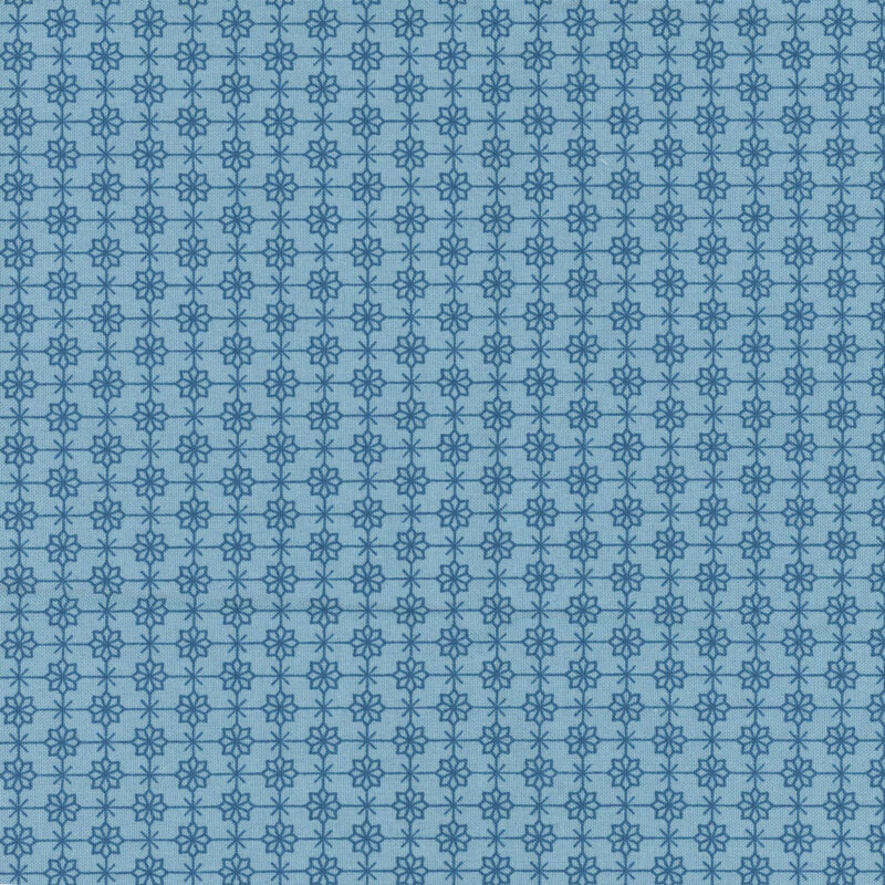 blue fabric featuring a compelling geometric dark blue grid with flowers and Xs alternating at each corner