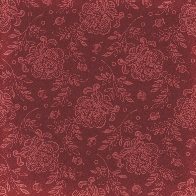 Image of fabric decorated with lacy tonal floral prints set against a dark red background