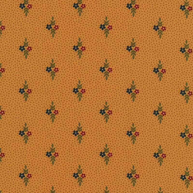 Fabric that features small motifs of red and blue flowers with sprigs of leaves on a dark golden background.