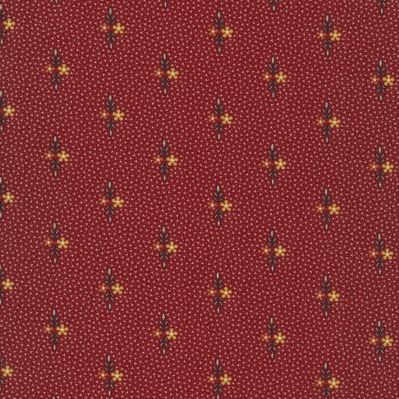 Fabric that features small motifs of red and golden yellow flowers with sprigs of leaves on a maroon red background.