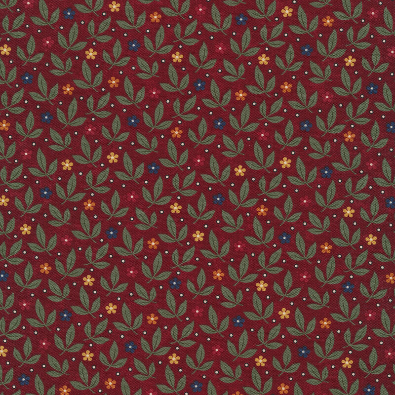Fabric that features a packed pattern of leaves and red, yellow, orange and blue ditsy flowers on a maroon red background