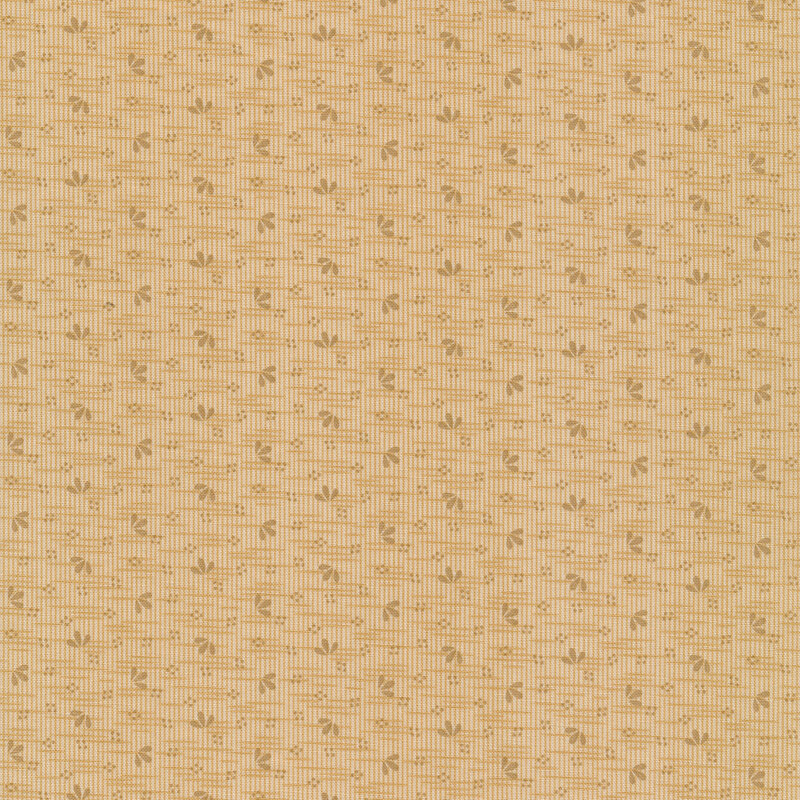 Fabric that features a tonal light tan woven texture design with small tossed leaves all over