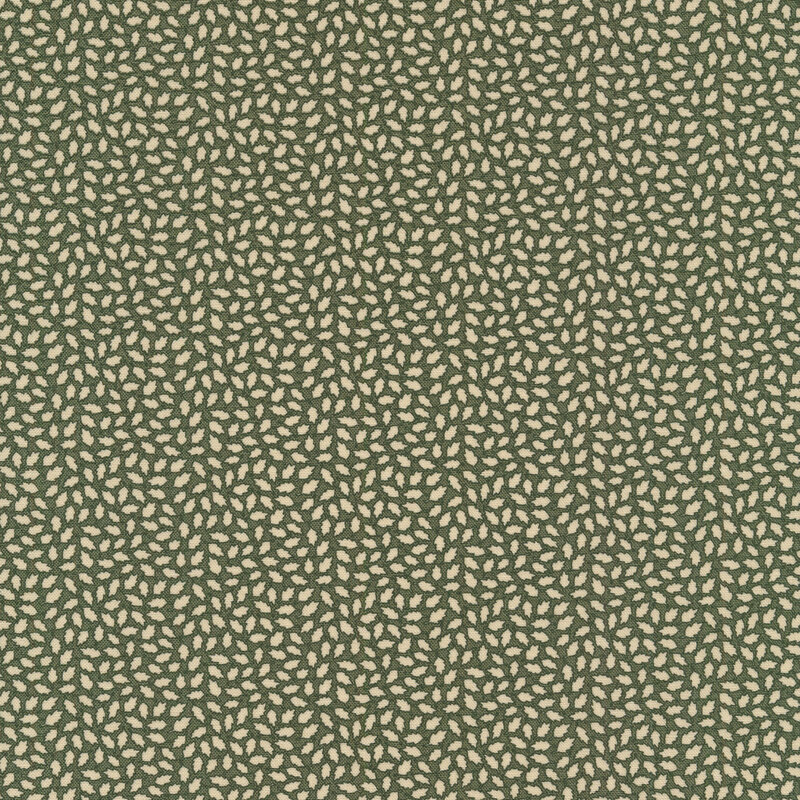 Fabric that features a lovely cream-colored leaf print on a dark evergreen background
