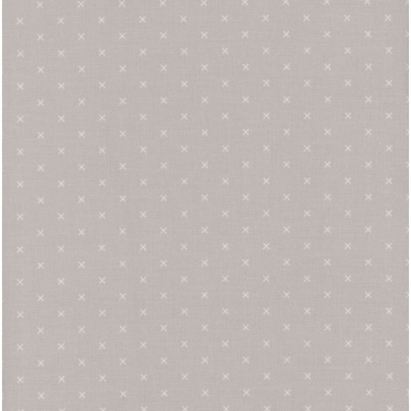 Swatch of fabric featuring tonal greige Xs on a light gray background
