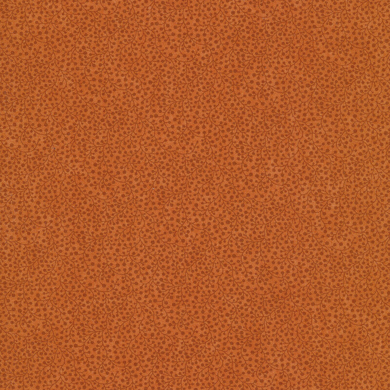 Fabric that features a lovely packed berry pattern in tonal burnt orange colors