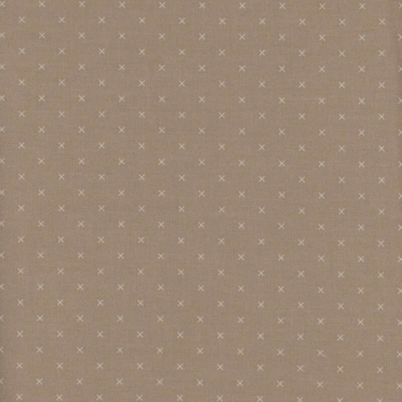 Swatch of fabric featuring tonal light tan Xs on a brown background