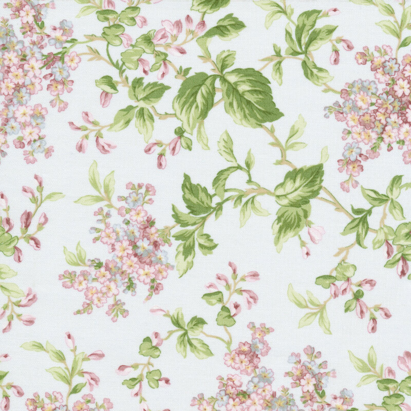 Light pale blue fabric with pink and purple lilac clusters and green branches across it