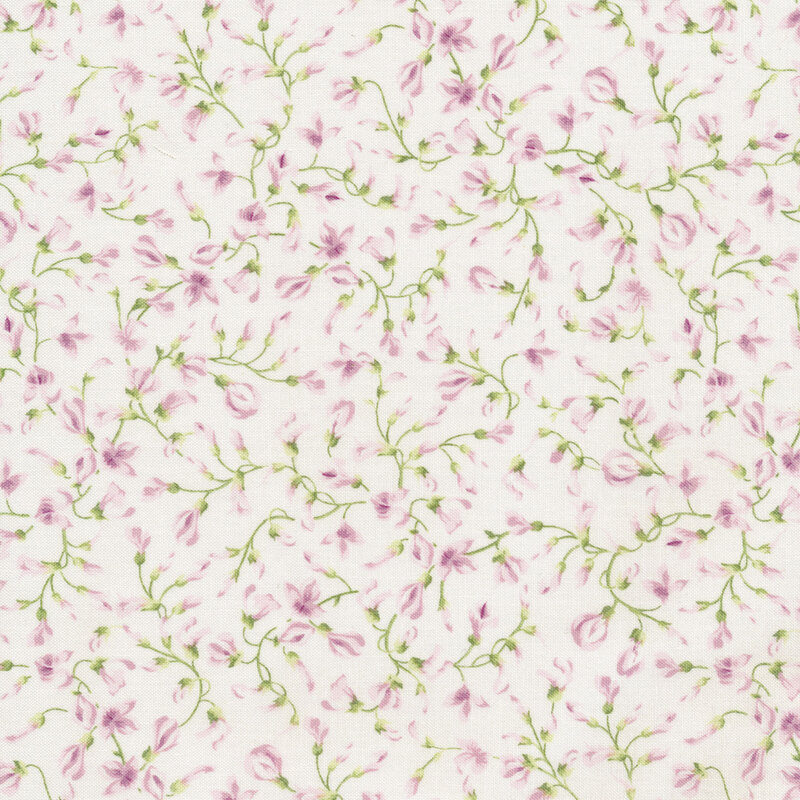 White fabric with winding green vines and light pink lilac buds across it 