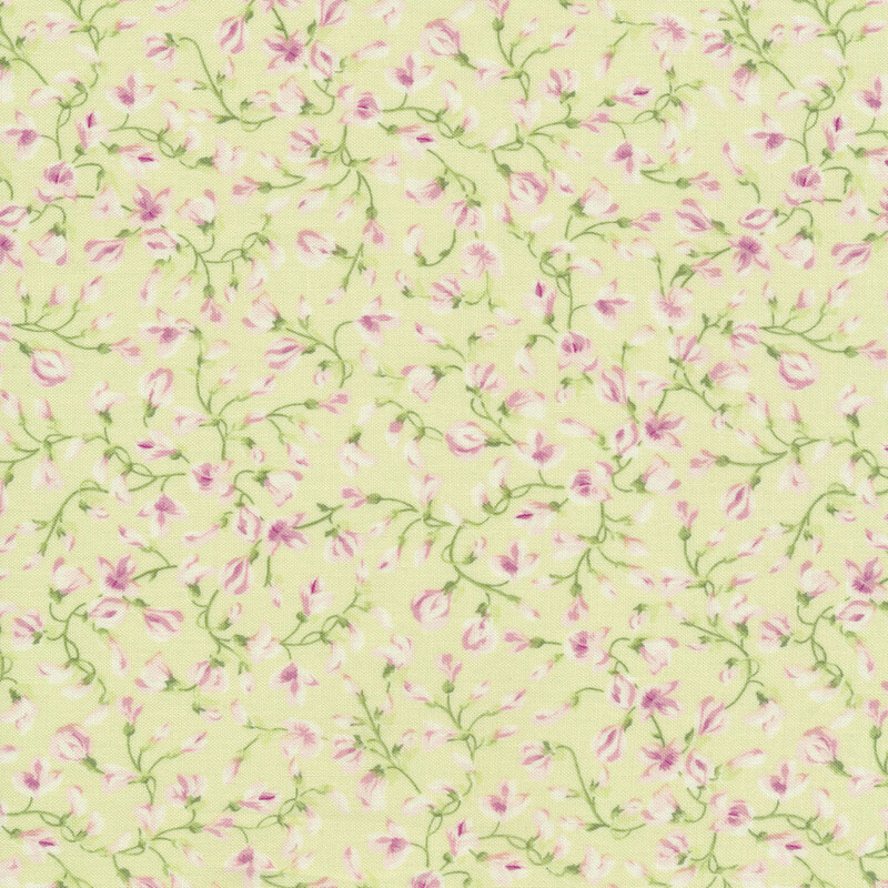 Light green fabric with winding vines and light pink lilac buds across it