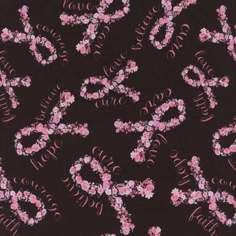 This fabric features a black background covered pink ribbons made of flowers framed with cursive pink words