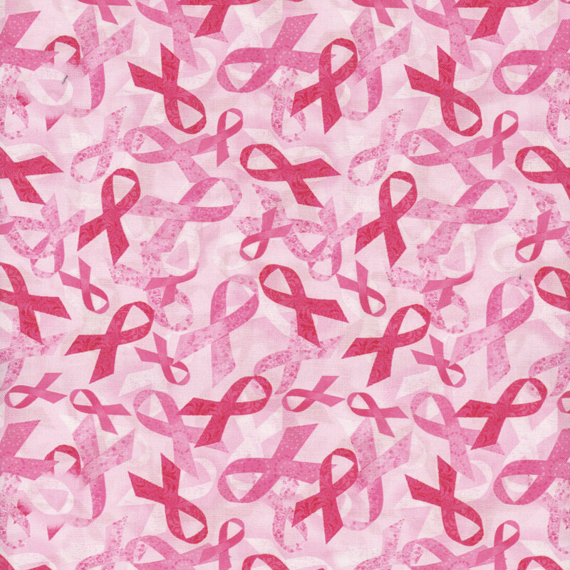 tossed pink ribbons in various shades of pink on a light mottled pink background