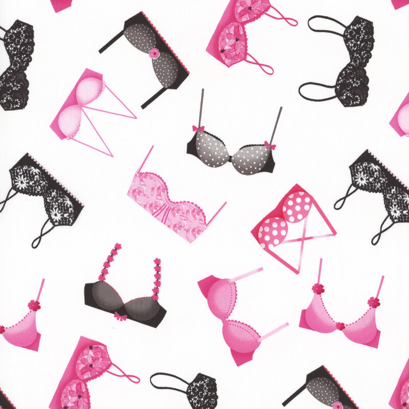 fabric with tossed pink and black printed bras with white background