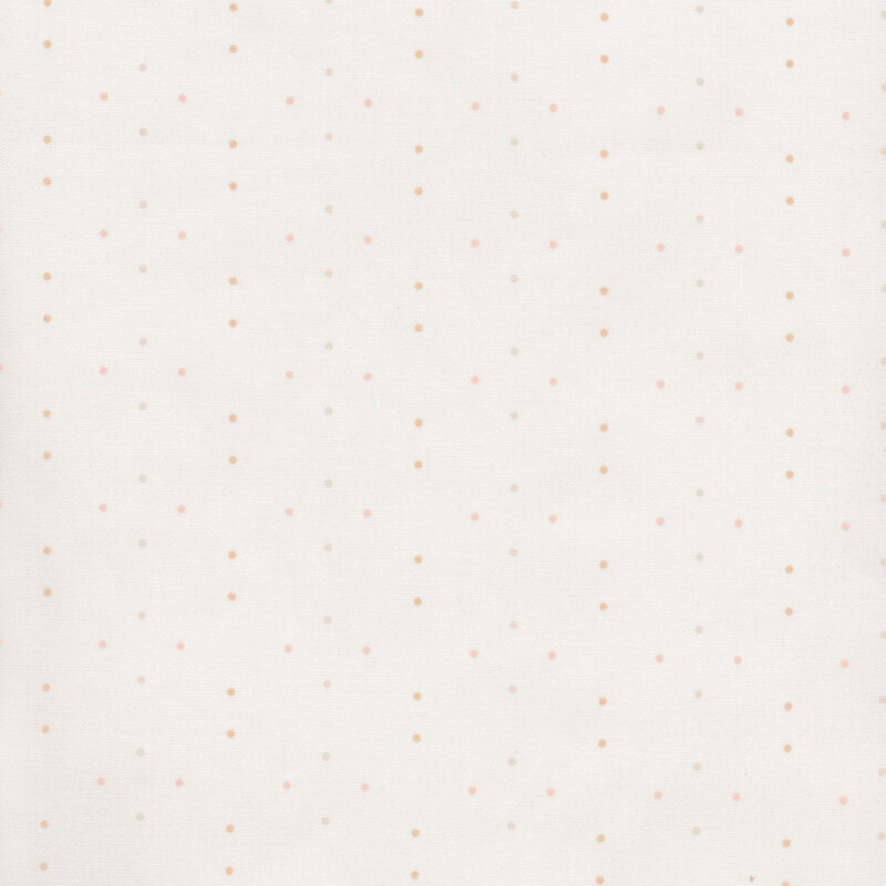 fabric featuring neutral polka dots on a cream white background