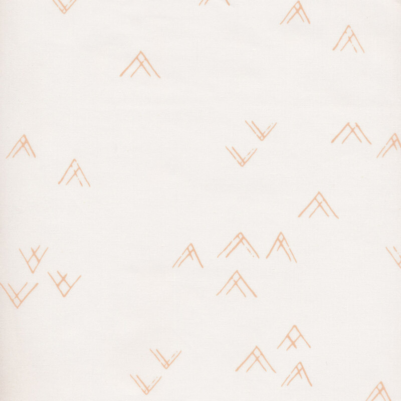 fabric with neutral tan chevrons in a random pattern on a cream background