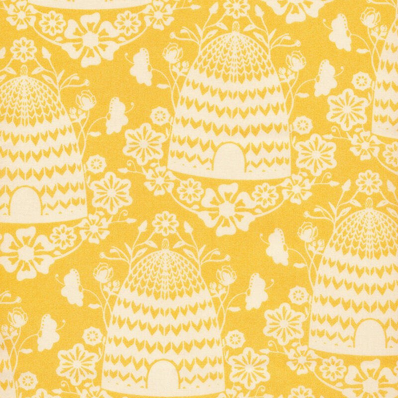 Image of fabric featuring light yellow beehives accented by floral prints set against a mustard yellow background