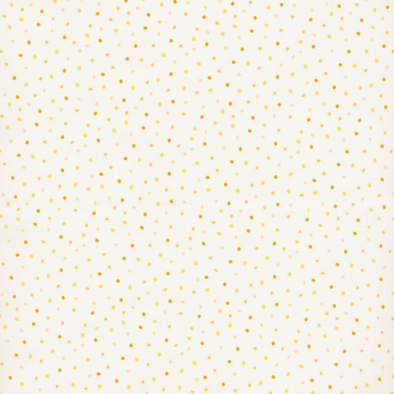 fabric featuring dots in various shades of yellow and ochre set against a light yellow background
