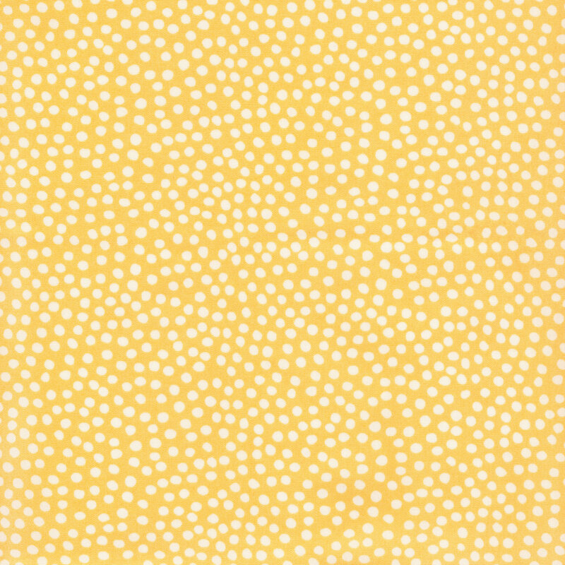  fabric featuring light yellow dots set against a mustard yellow background
