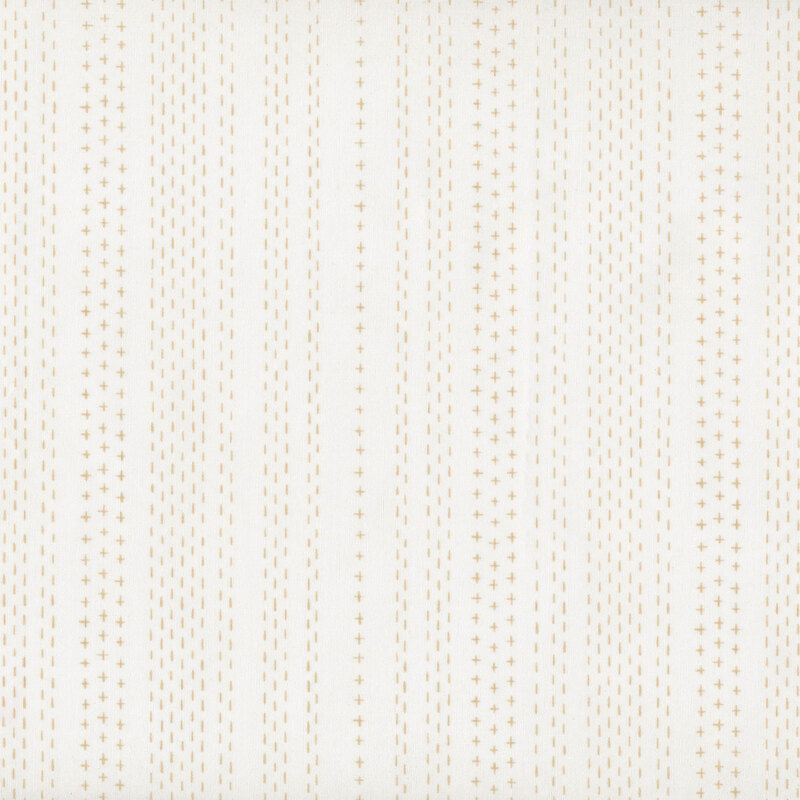 fabric featuring vertical rows of golden tan dashed lines and crosses on a cream background