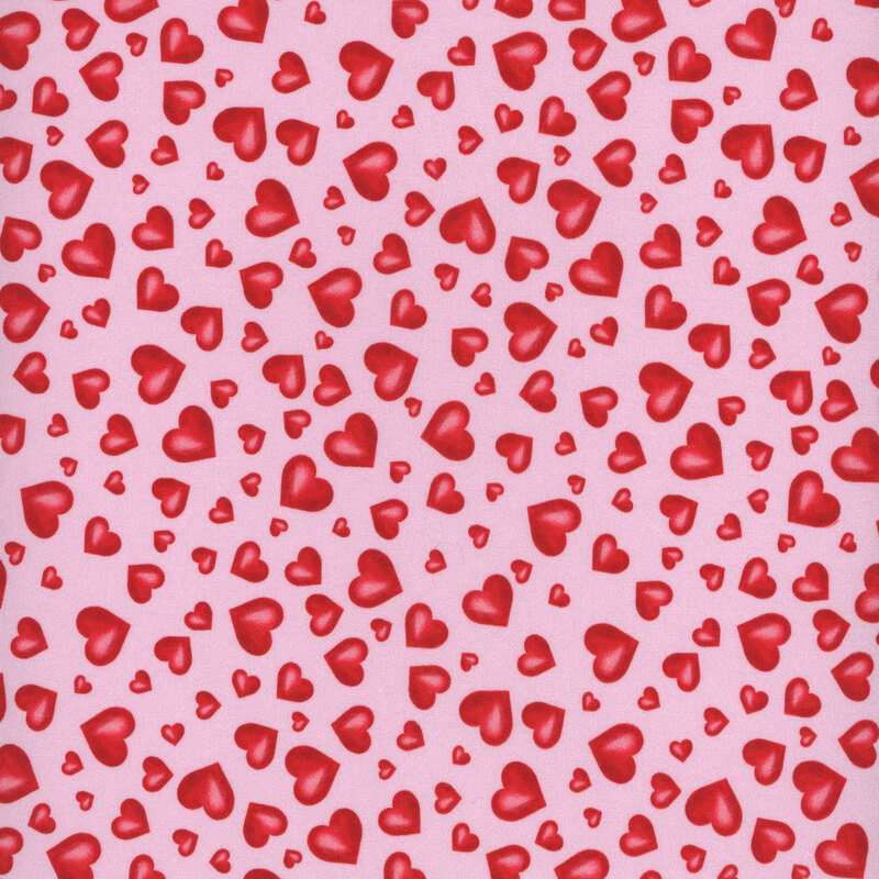 fabric featuring bright red tossed hearts on a bright pink background