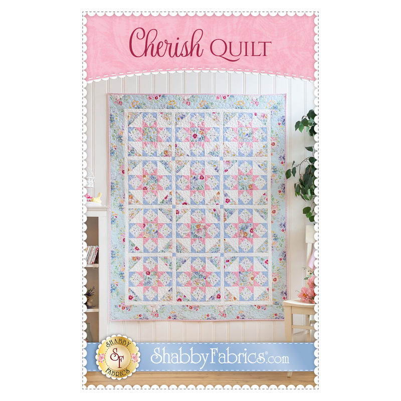Front of the pattern booklet showing the finished quilt hanging on a white paneled wall with the title at the top