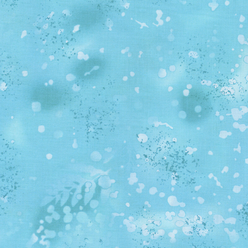 variegated blue fabric with light splatters and mottling